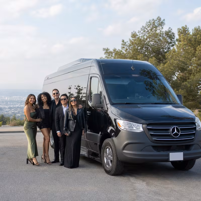 Group beside a Mercedes Sprinter limo from the Los Angeles fleet