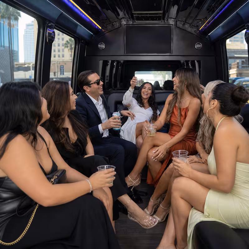 Party bus interior with wraparound leather seating and LED lighting in Los Angeles