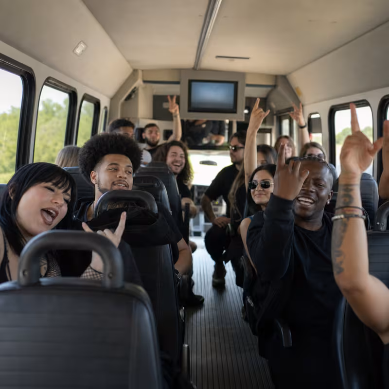 Party bus interior with wraparound leather seating and LED lighting in Los Angeles
