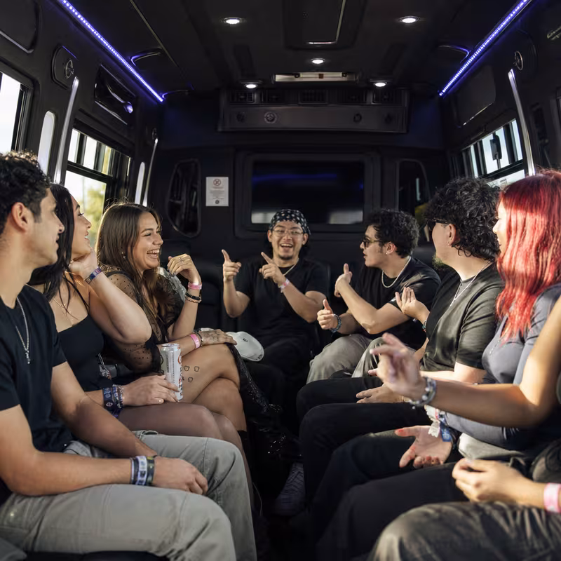 Passengers loading luggage while boarding an Los Angeles group shuttle