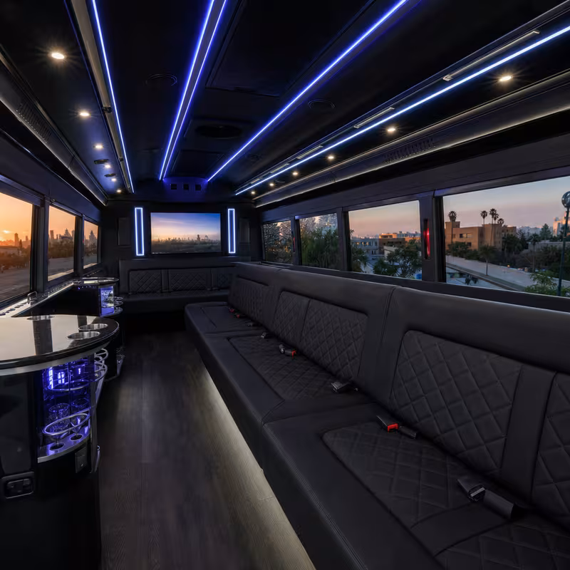 Party bus interior with wraparound leather seating and LED lighting in Los Angeles