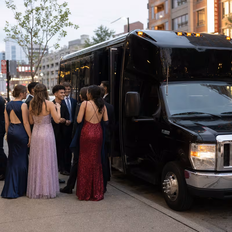 Passengers loading luggage while boarding an Los Angeles group shuttle