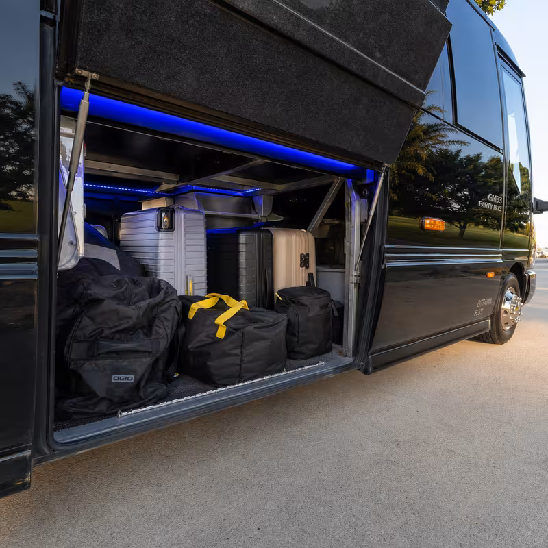 Party bus interior with wraparound leather seating and LED lighting in Los Angeles