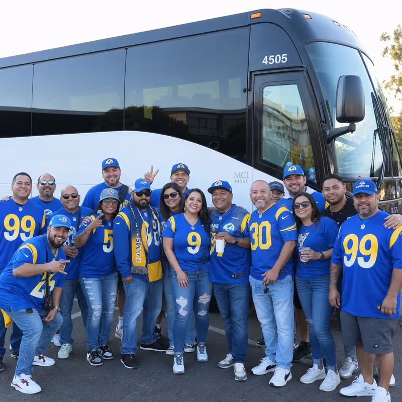 Passengers loading luggage while boarding an Los Angeles group shuttle