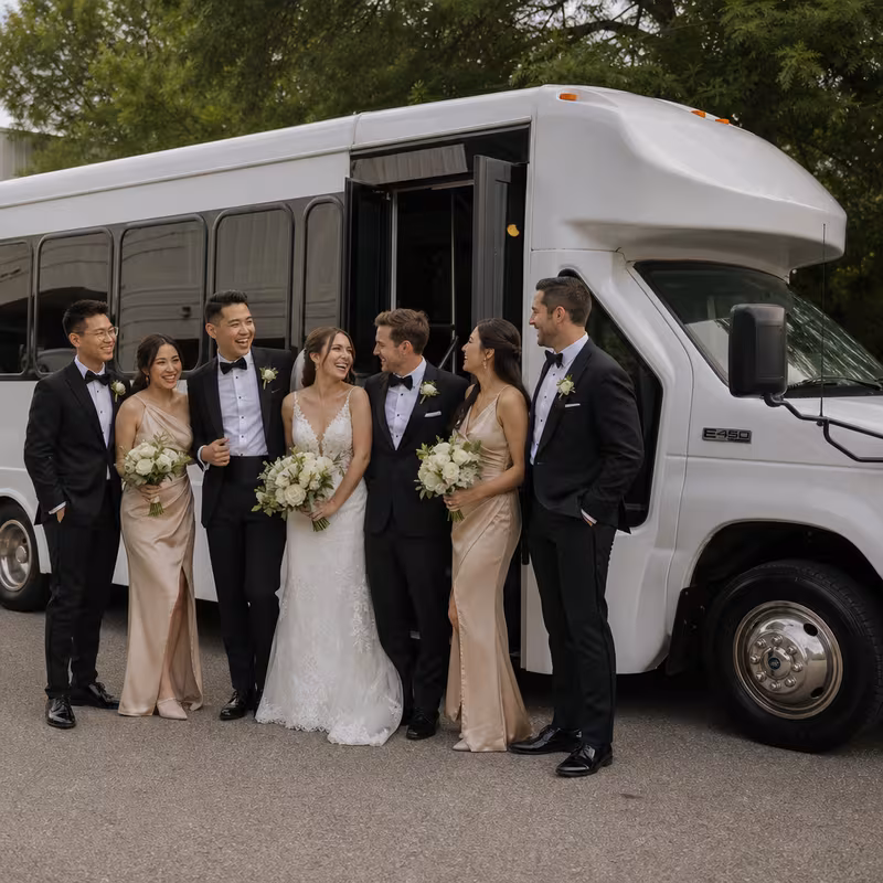 Passengers loading luggage while boarding an Los Angeles group shuttle