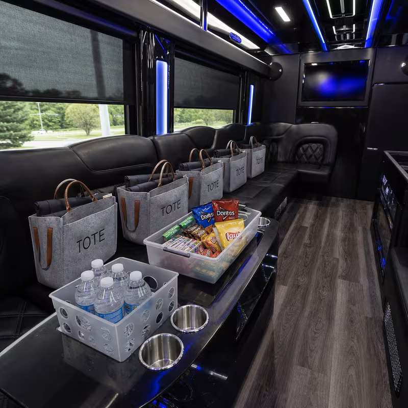 Party bus interior with wraparound leather seating and LED lighting in Los Angeles