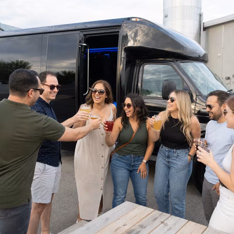 Passengers loading luggage while boarding an Los Angeles group shuttle